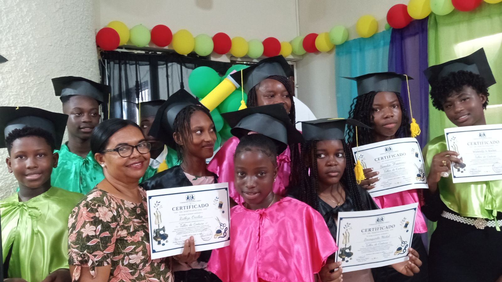 Graduating students gathered with certificates